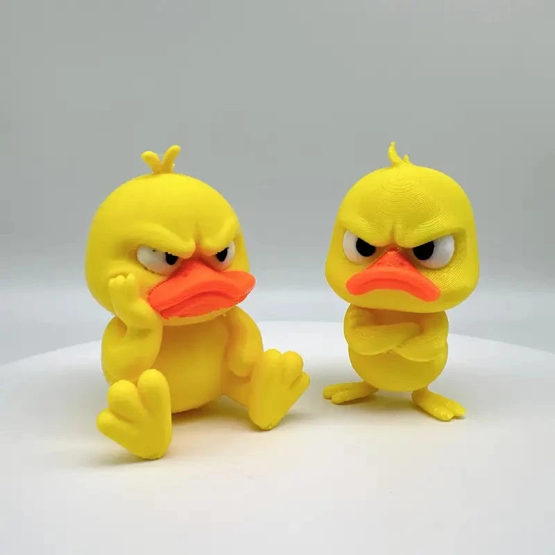 

3D Printing Funny Angry Duck Statue: Yellow Figure with White Eyes – Humorous Decor for Indoor/Outdoor Home & Car