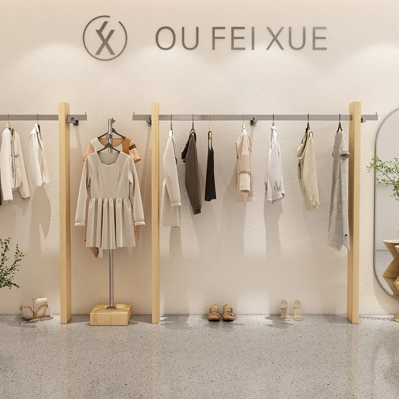 

Women's clothing store wall display rack Solid wood clothing store shelf Stainless steel clothing hanger