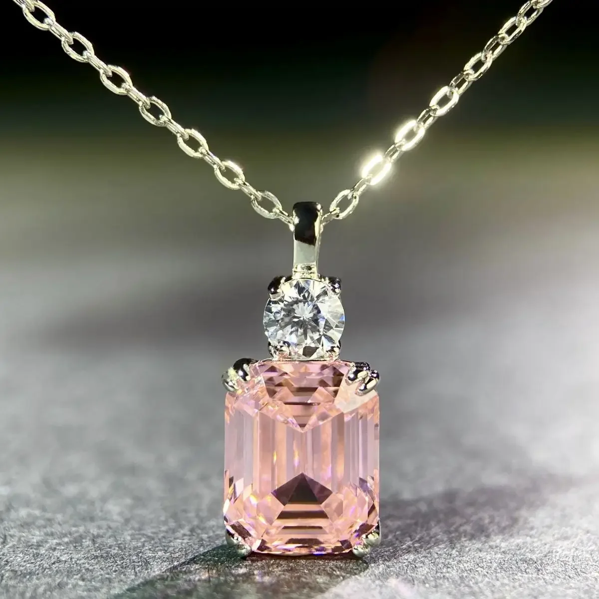 PT950 platinum bracelet with an elegant minimalist Emerald Cut pyramid pendant and pink gemstone necklace