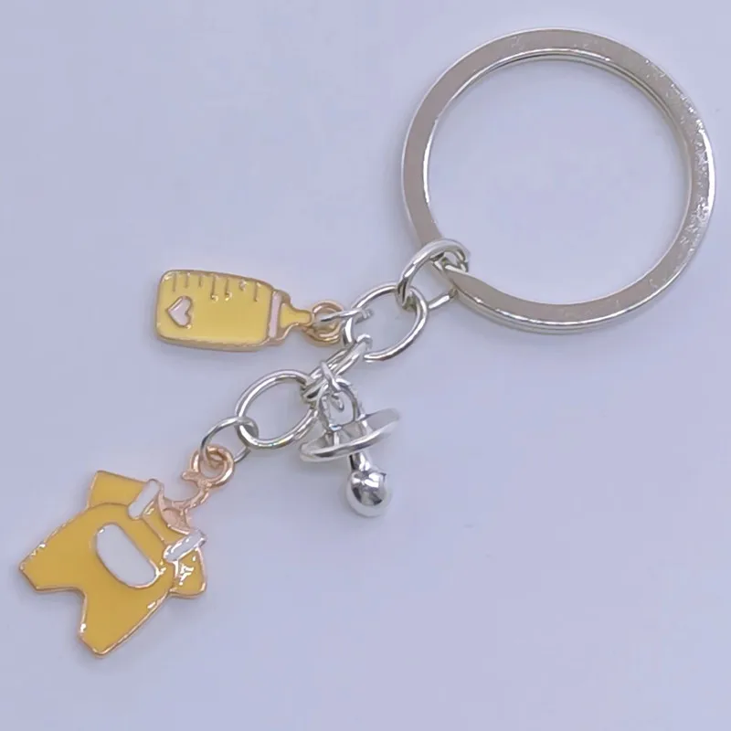 

cute baby bottle keychain cute baby clothes bottle pacifier keychain mom hug theme keychain mother's day souvenir jewelry