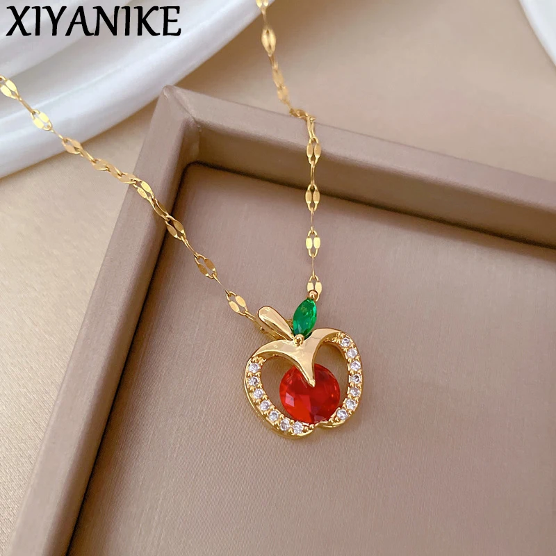 XIYANIKE 316L Stainless Steel Hollowed Out Apple Red Rhinestone Pendant Necklace For Women Niche Personalized Clavicle Chain