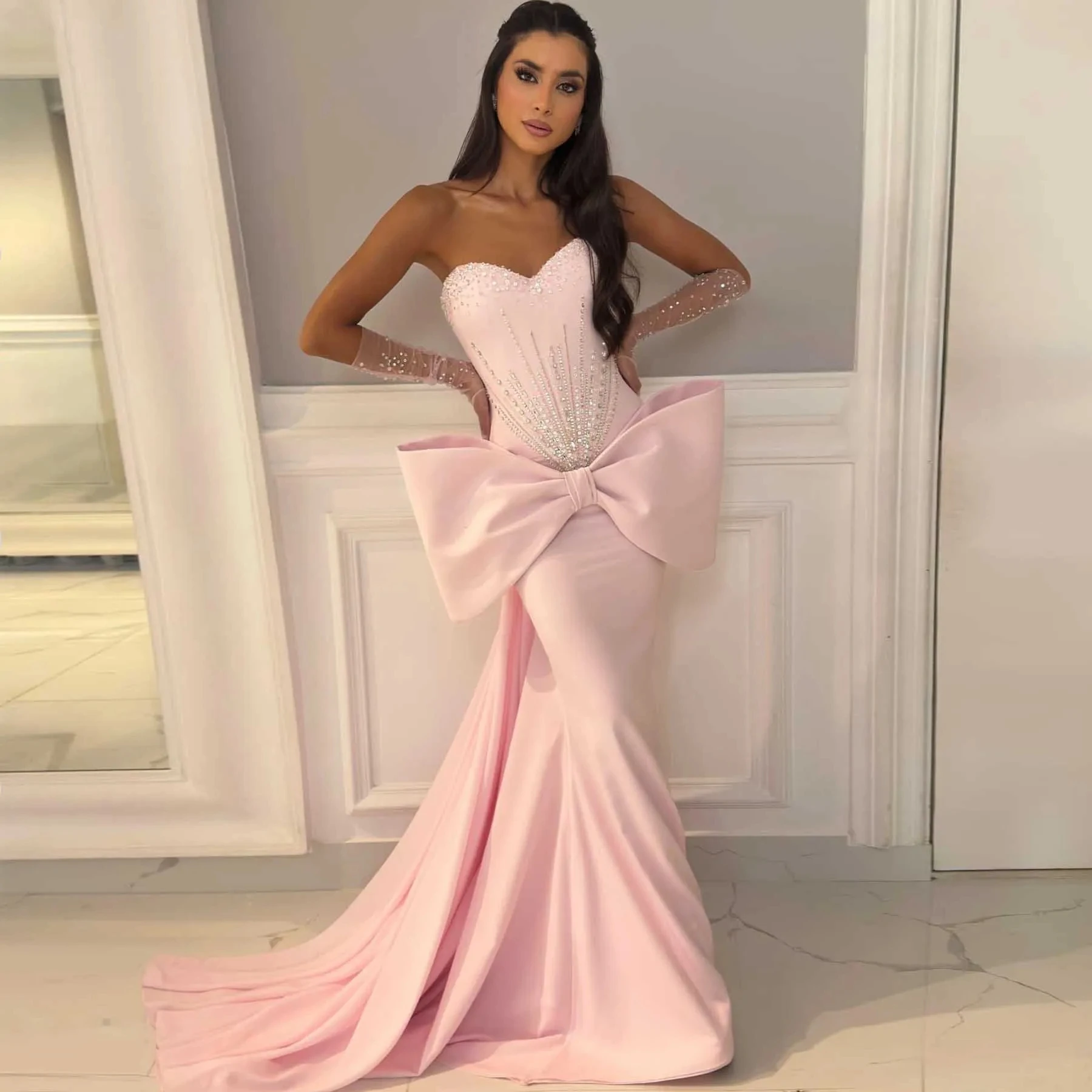 

Модное розовое платье знаменитости для выпускного вечера 2026 Милая расшитая бисером и блестками с большим бантом Русалка Вечерние вечерние платья Vestidos De Longo