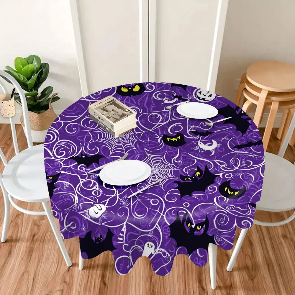 One Halloween-themed tablecloth, featuring a pattern of spooky spider webs and bats.zyc