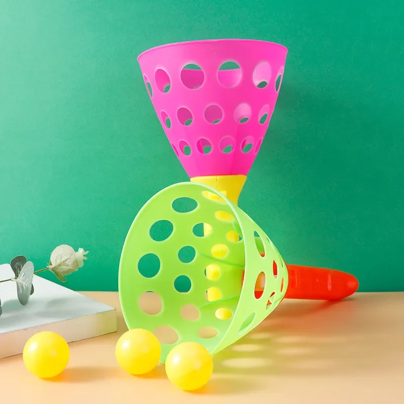 Un par de juguetes deportivos de plástico para niños, pelota de catapulta doble, pelotas de lanzamiento para padres e hijos, juguete interactivo, juego de guardería al aire libre