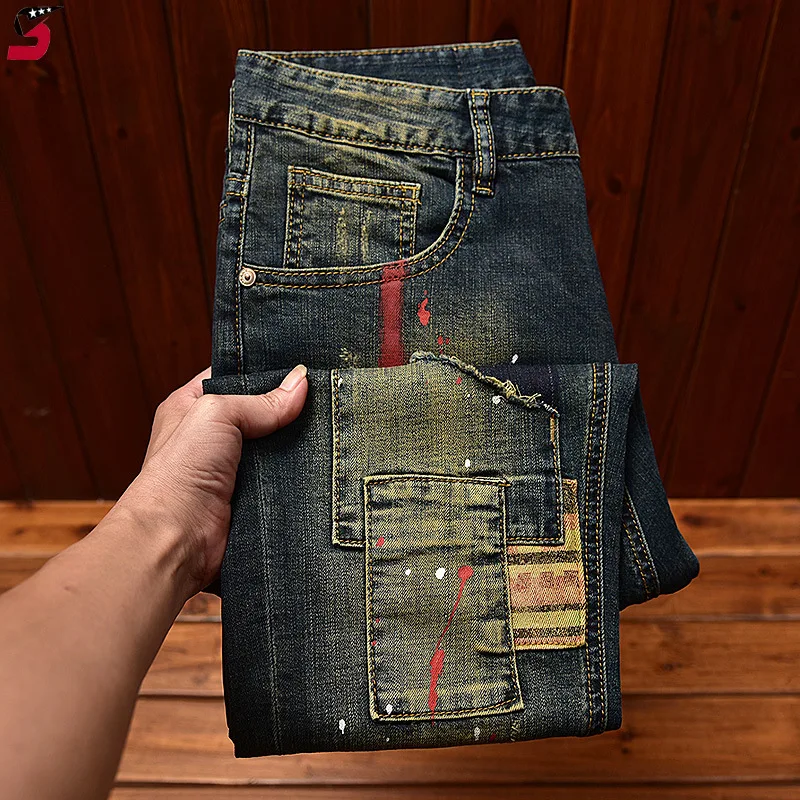 Celana jeans Motor pria, celana panjang retro tampan, jalanan, ketat, melar, cetakan grafiti, LUBANG & tambalan, modis jahitan