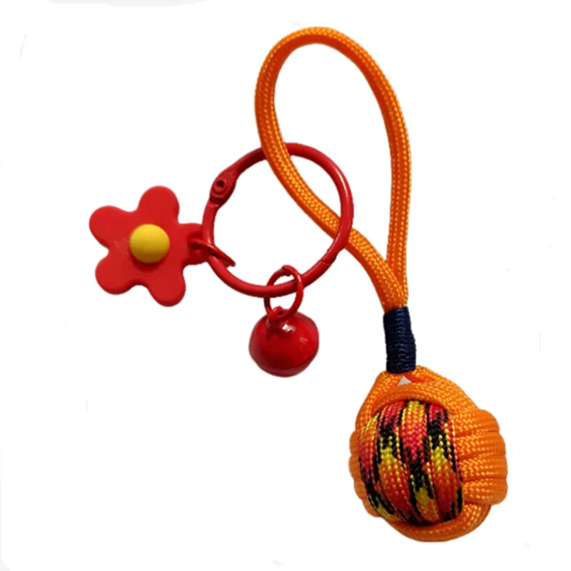

31/5000 Handcrafted Monkey fist decorated ball + red flower bell key chain for couples and best friends, versatile bag pendant