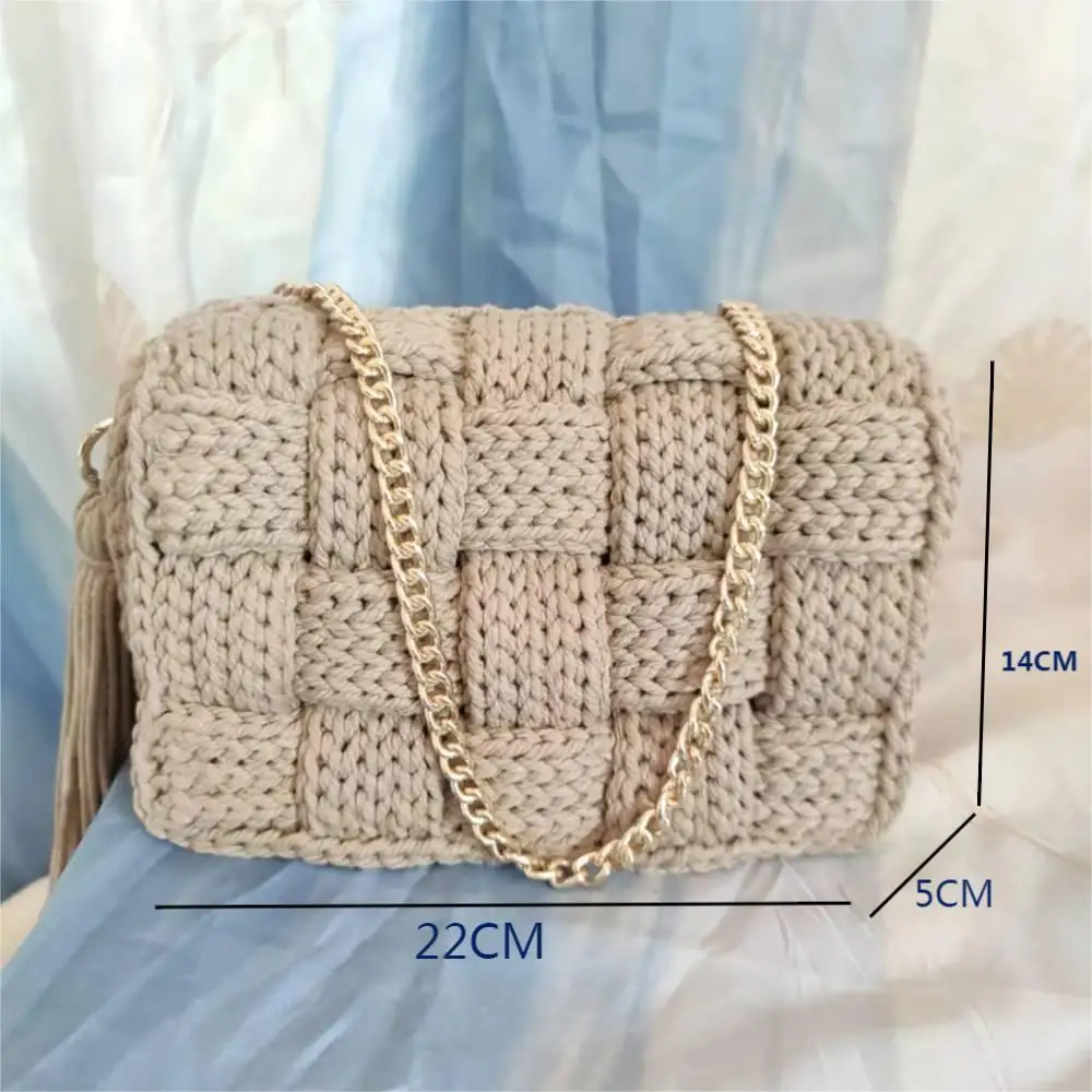 cotton by hand knits bag, single shoulder slope across packets, tasseled cross product package