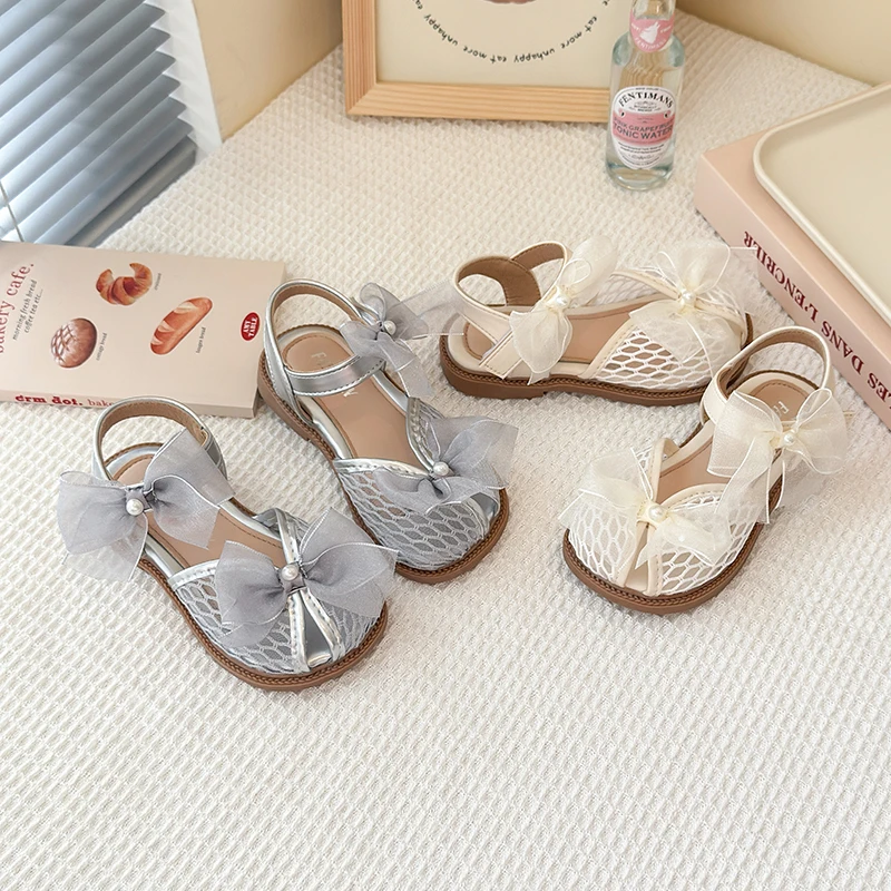 

Girls Sandal 2025 Summer New Bow Pearl Girls Mesh Comfort Non-slip Performance Sandal Fashion Soft Princess Net Single Shoes