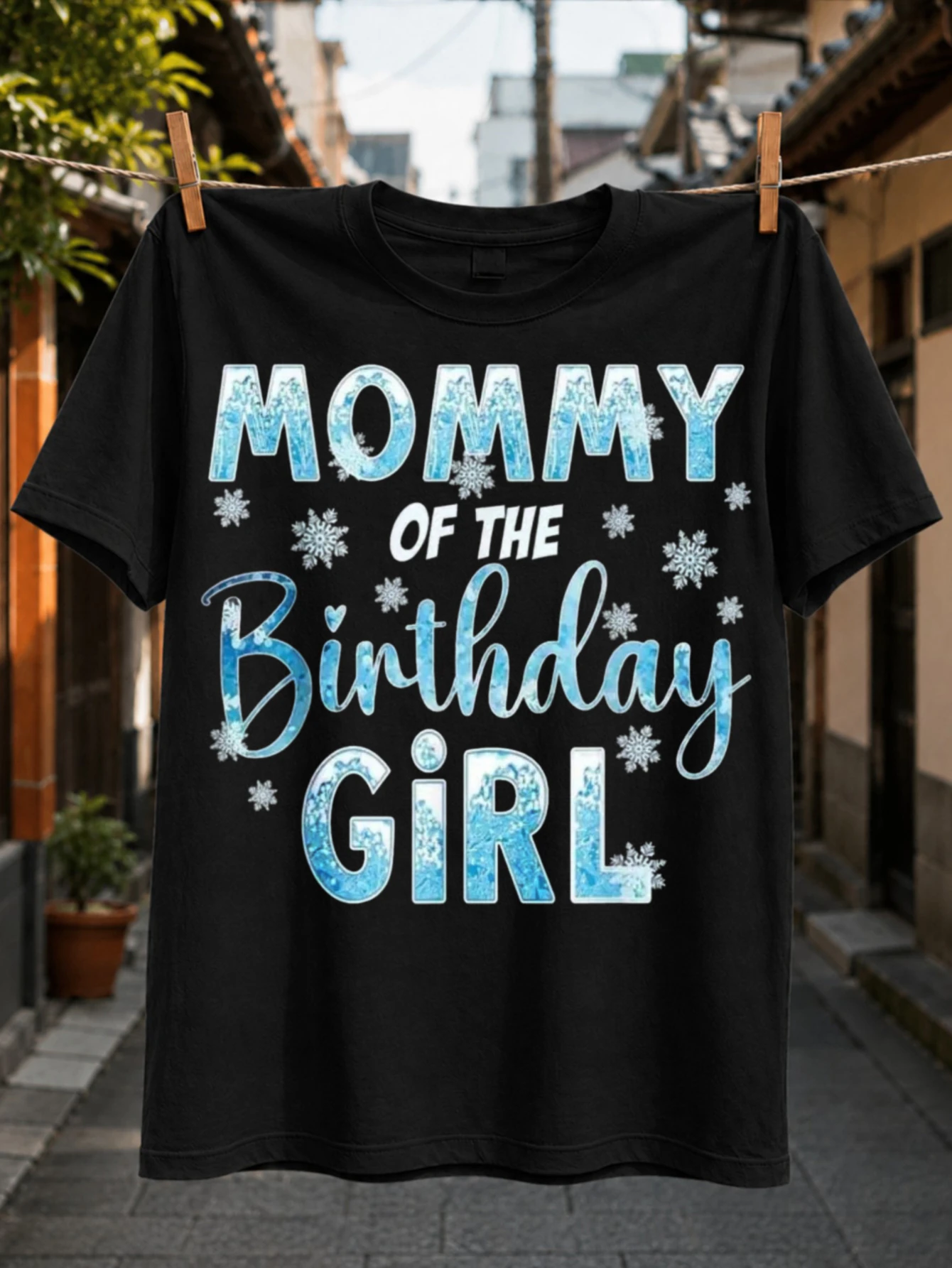 Mommy of the Birthday Girl Ice Blue Quote sparkling blue lettering surrounded by snowflakes and  Unisex All T-Shirt