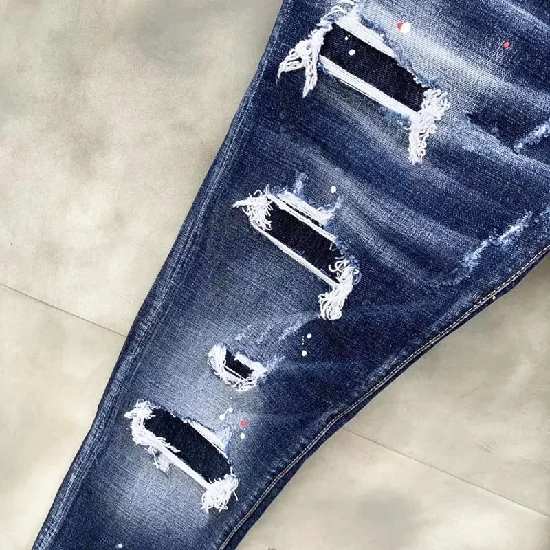 2024 Jeans strappati da uomo marchio di lusso fori azzurri Jeans lunghi qualità Street Fashion maschile Stretch pantaloni Skinny abbigliamento uomo