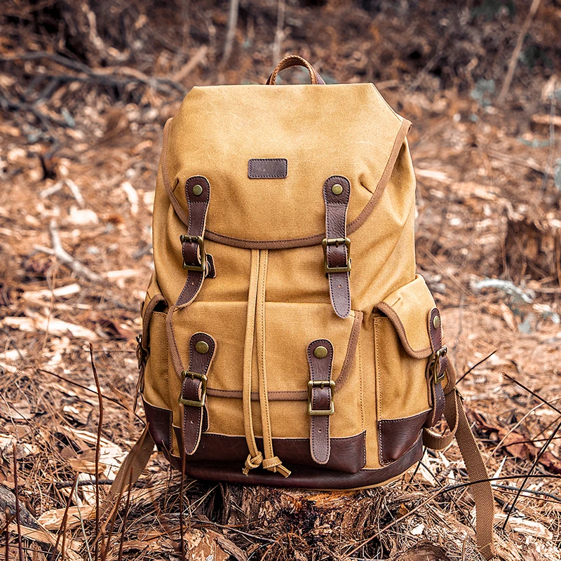 

Canvas backpack with dual shoulder straps, casual and lightweight for men, retro style, outdoor use, large capacity for travel.