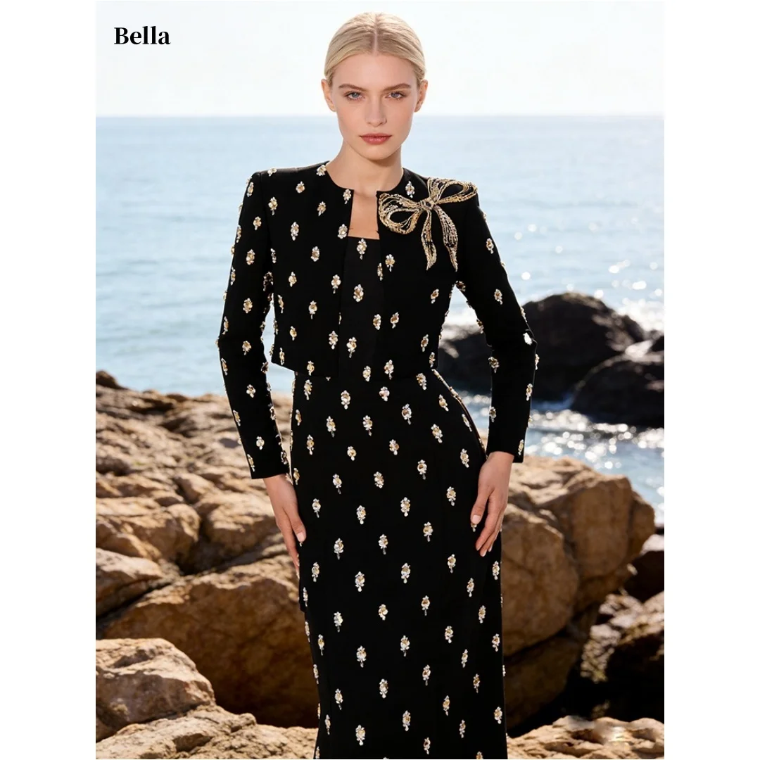 

Изысканное черно-золотое вечернее платье Bella с цветочной вышивкой, длинными рукавами, бантом и приталенным силуэтом, длина миди