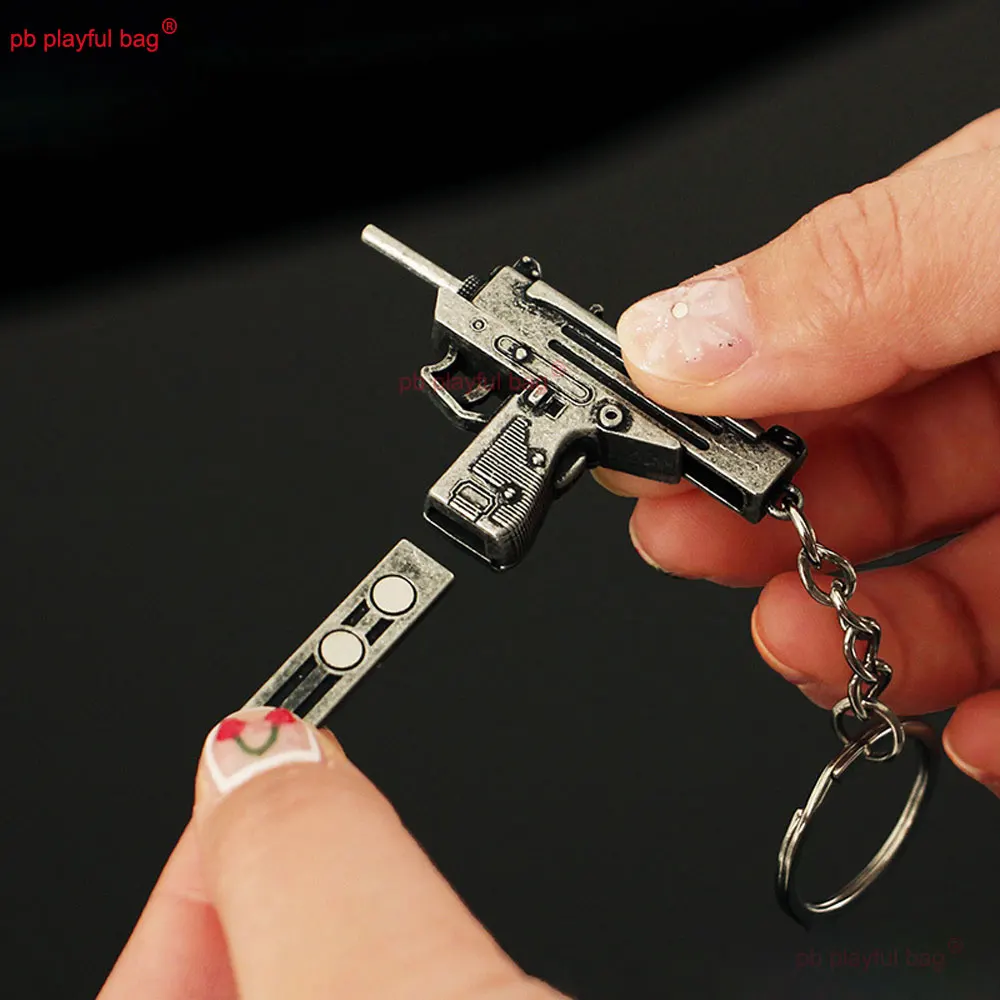 5cm Mini UZI arma de juguete modelo llavero colgante llavero de Metal extraíble decoración manualidades juego figura de acción regalos para niños ZG397