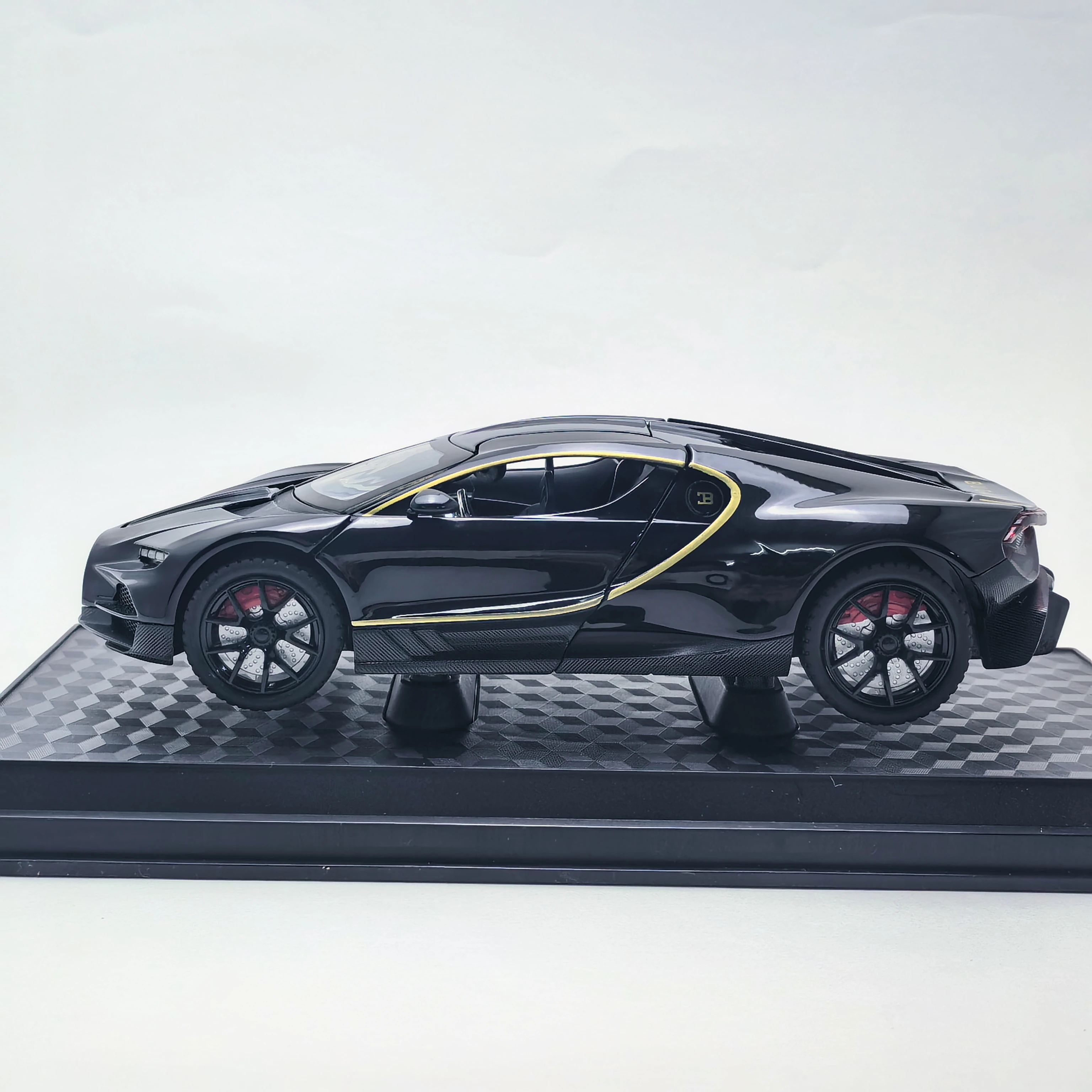 

1:24 scale black premium die-cast model car - top-hinged doors, perfect as a holiday gift, comes with a fixed base