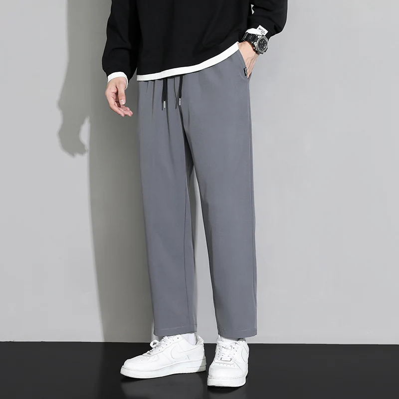 

Men's loose-fit drawstring pants with elastic waistband, straight leg, casual and comfortable, soft, suitable for all seasons.