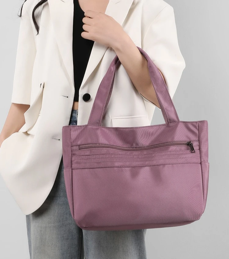 

Urban simple and lightweight nylon single-shoulder large-capacity multi-pocket computer storage hand-held crossbody tote bag