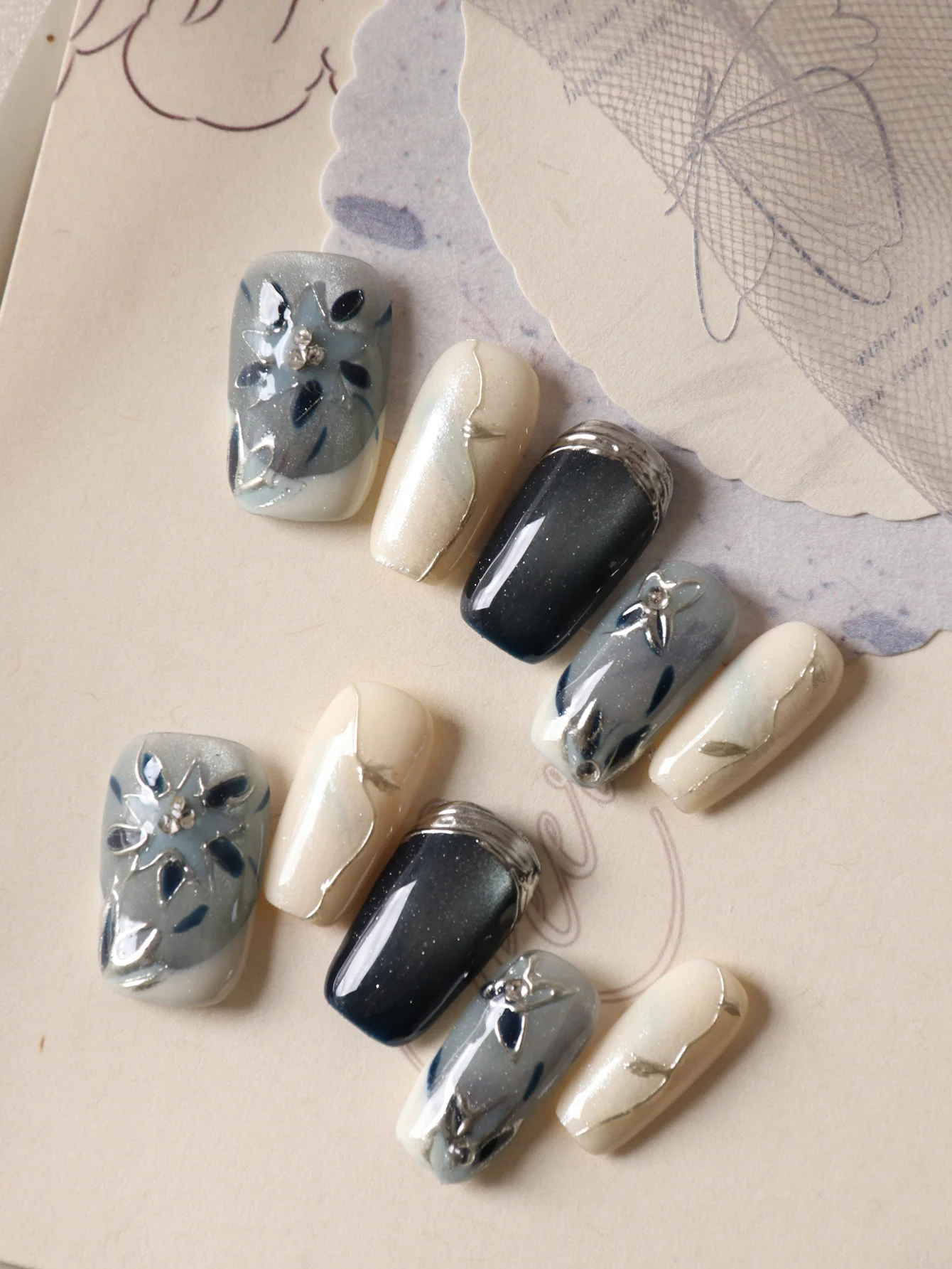 10Pcs Press on Nails Short Blue Cat's Eye Flower Silvery Yellow Fake Nails Includes 1 Sheet of Adhesive Tabs & 1 Pc Mini File