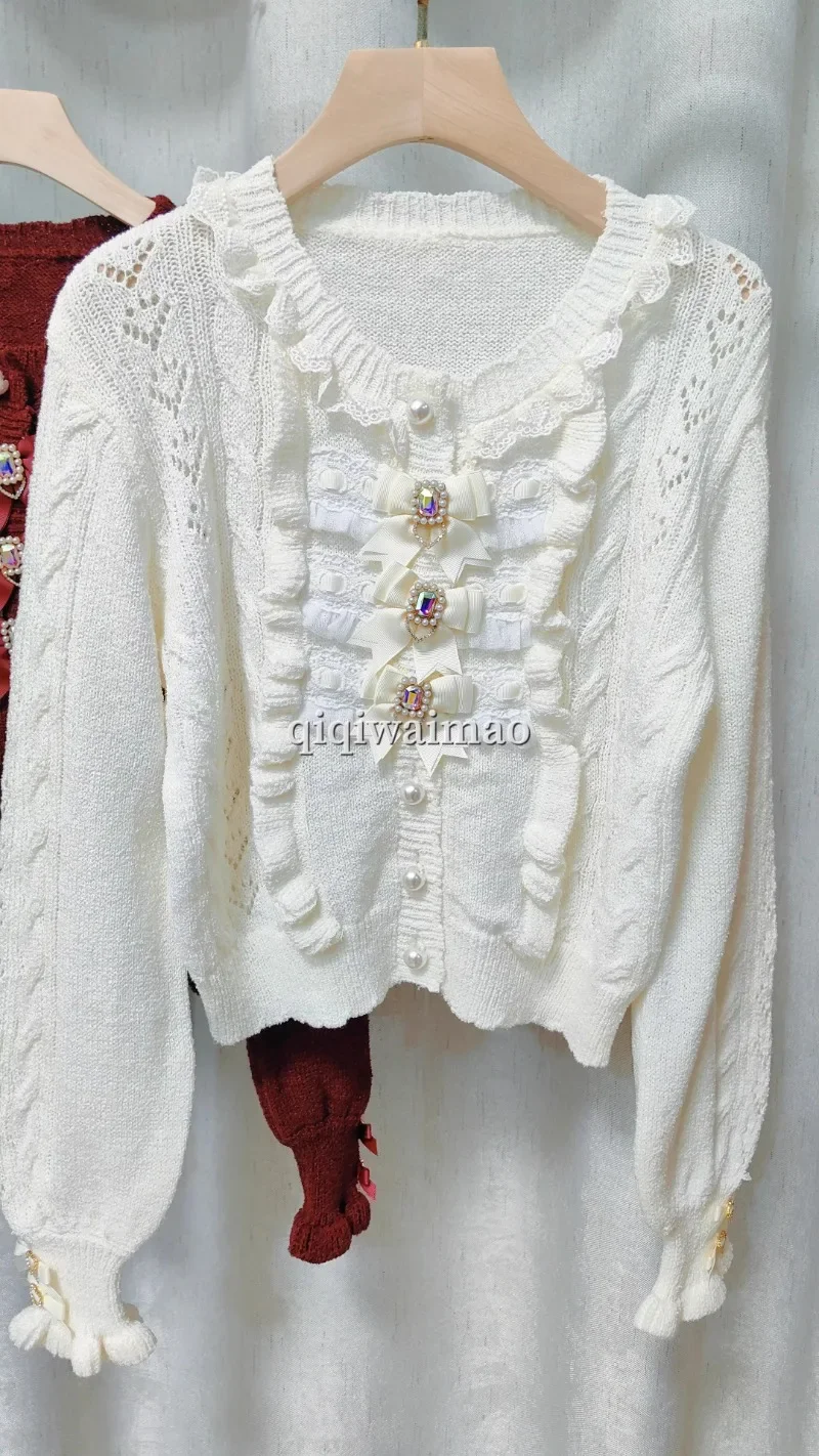 Primavera e autunno nuove ragazze dolci cardigan corto lavorato a maglia miniera cravatta fiocco in pizzo scavato girocollo maglione con fibbia di perle