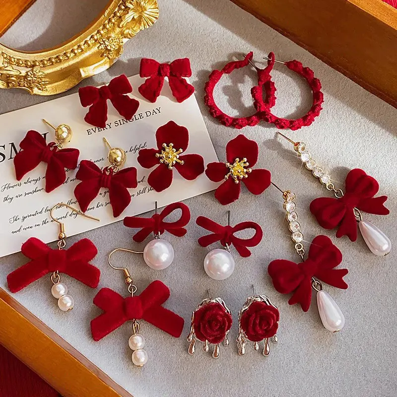 الأحمر احتفالي السنة الجديدة الزفاف المرأة الأقراط الراقية شخصية انخفاض الأقراط شكل قلب زهرة شكل فراشة عقدة الشكل