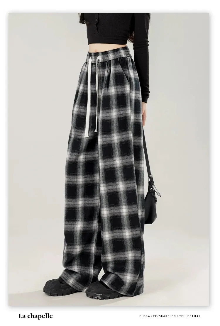 女性用の特大の黒い市松模様のスウェットパンツ,だぶだぶのカジュアルパンツ,伸縮性のあるウエスト,ポケット,学生,ユニセックス,ヒップホップ,ルーズフィット,ファッション