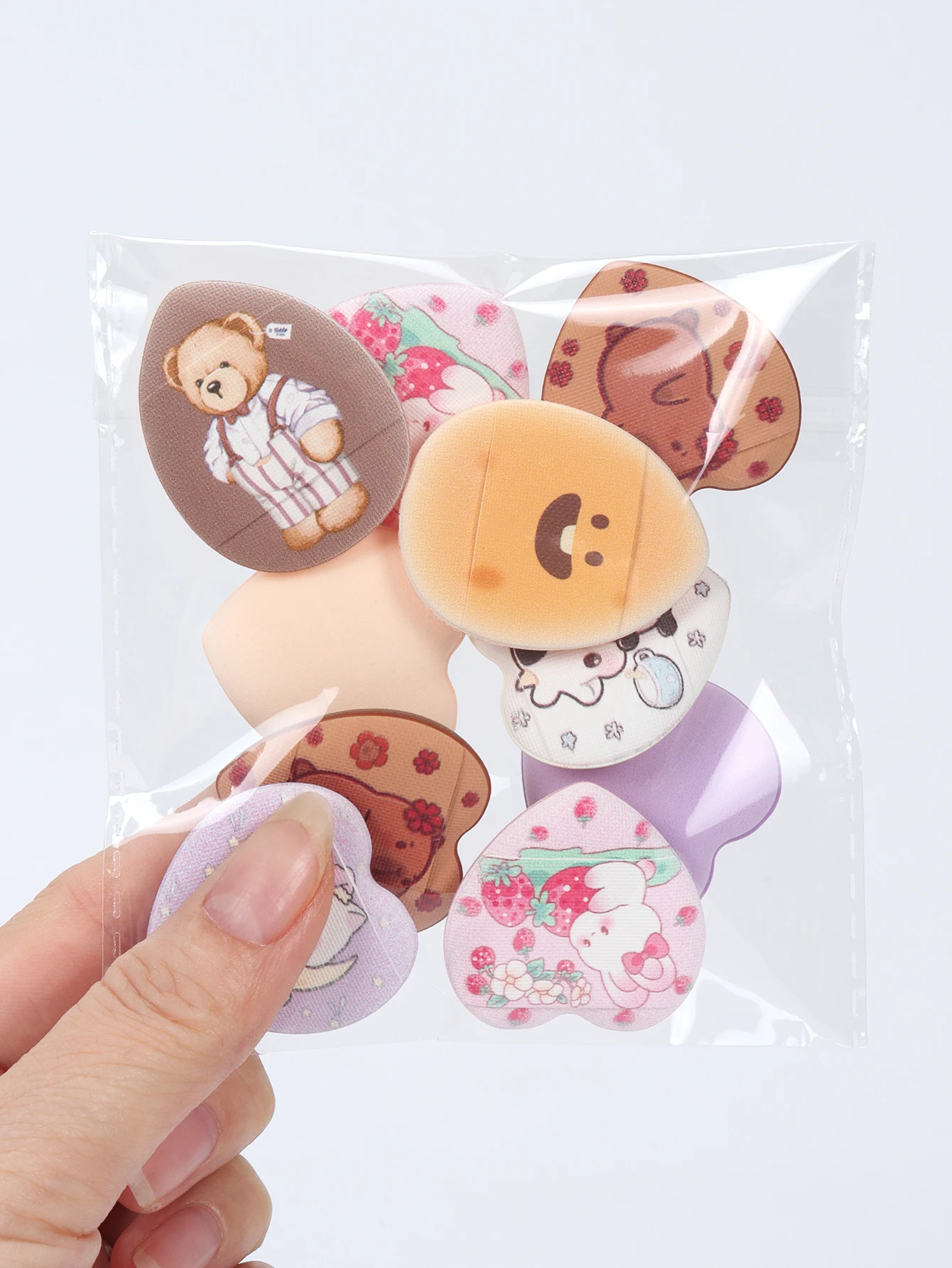 ランダムに印刷された指用パウダーパフ 5-10-20-50-100 個、水にさらされると膨らむ、湿った状態でも乾いた状態でも使用できます