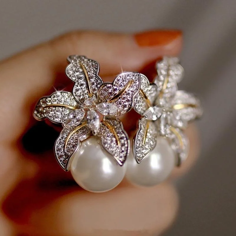 Stunning two-tone floral pearl earrings for women, featuring luxurious sparkling diamond stones, perfect for wedding fashion jewelry.