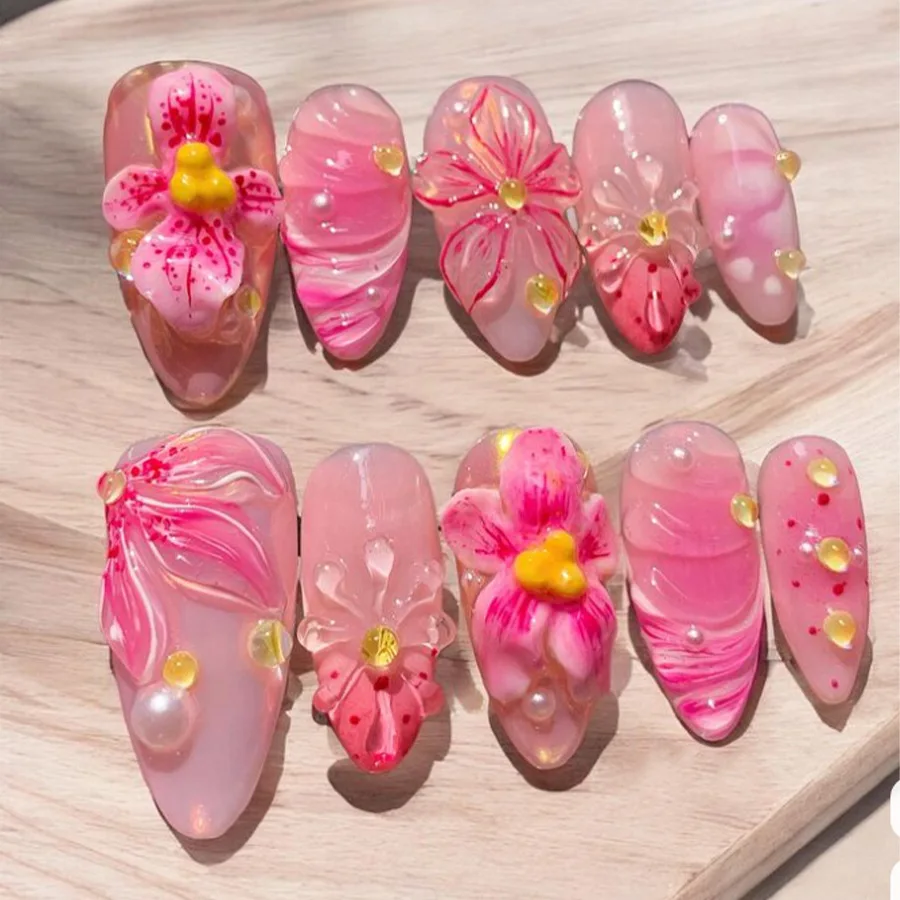 

24pcs Finished Pink Almond Press on False Nails Cute Flower Butterfly Design Stick on Nail Sets with Pearl Design Fake Nails Tip