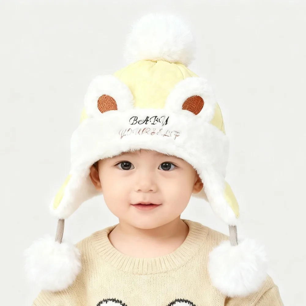 Nieuwe warme winterbabymuts met bont gevoerde winddichte oorbeschermingshoeden met baloorflap
