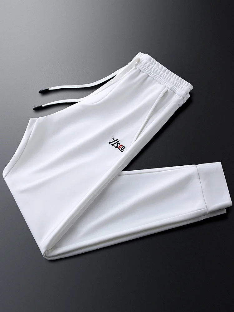 

Белые повседневные спортивные брюки мужские, зауженные, не требующие глажки, с вышивкой, на эластичной талии, с манжетами, тонкие, модные, городские, летние