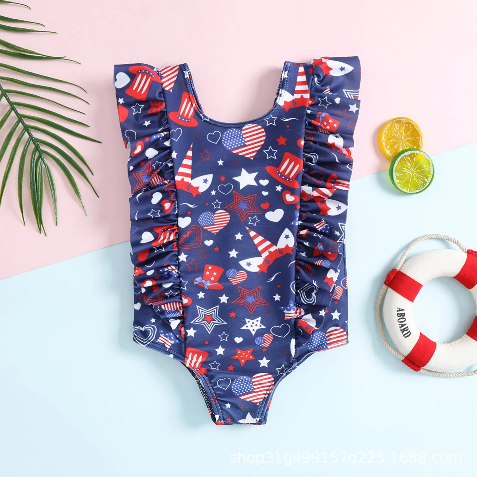 Toddler one piece swimsuit with ruffle and star heart top hat pattern for beach and pool water play
