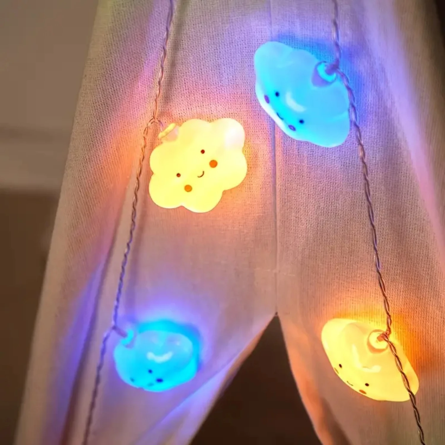 Colorful, whimsical Battery Operated Small String Lights ideal for Kids Room Decor - featuring Happy Face Clouds and Stars Theme