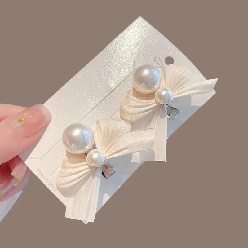 ใหม่หวานโบว์ไข่มุกผมคลิปสําหรับเด็กผู้หญิงสีชมพู Bowknot เจ้าหญิงด้านคลิป Bangs คลิปเด็ก Barrettes อุปกรณ์เสริมผม