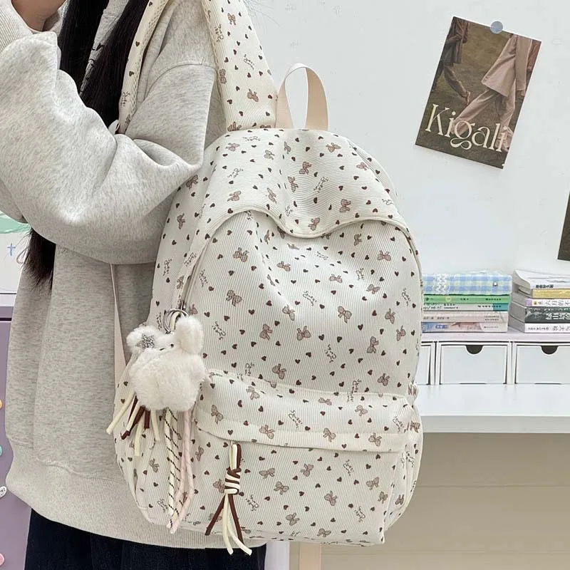Mini Bow And Heart All Over Print Textured Fabric Backpack Available Gentle Style Large Capacity Student Commuter School Bag