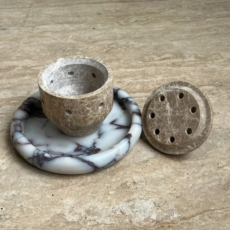 Natural marble incense burner with a perforated surface design and creative home desktop aromatherapy candle holder decoration