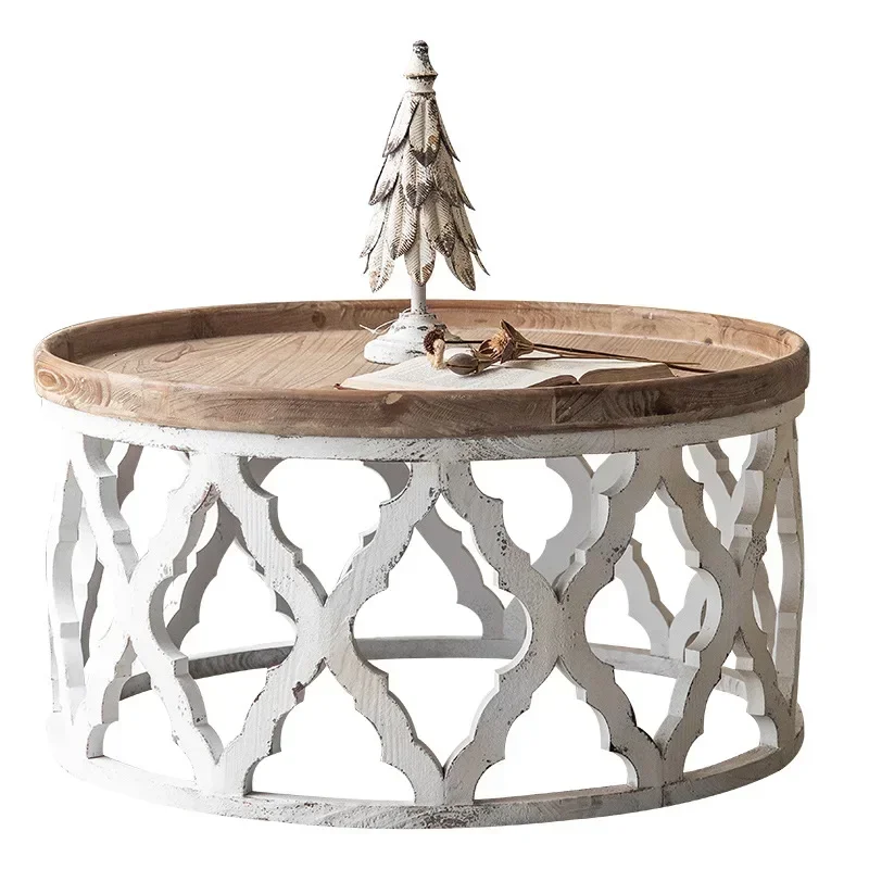 American retro hollow, solid wood coffee table, white in the living room of the B & B, simple log small round table