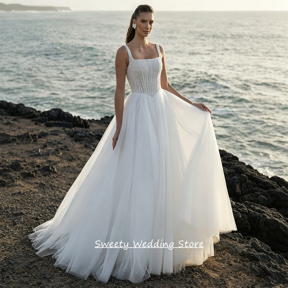Maßgeschneidertes Perlen-Hochzeitskleid Robe De Mariee Ärmellos Quadratischer Ausschnitt Perlenverzierung Durchsichtig Schleppe Glitzer Brautkleid