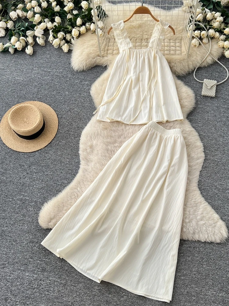 

Летний новый простой и свежий комплект из двух предметов: женский топ без рукавов с завязками и длинная юбка с высокой талией, повседневный комплект для работы и отдыха.