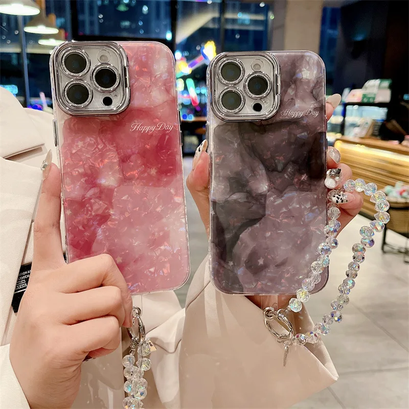 Luxuriöse Glitzer-Linsenhalterung mit Farbverlaufsmuschelmuster, Handyhülle mit Handgelenkkette für iPhone 16, 15, 14, 13 Pro Max, stoßfeste Abdeckung