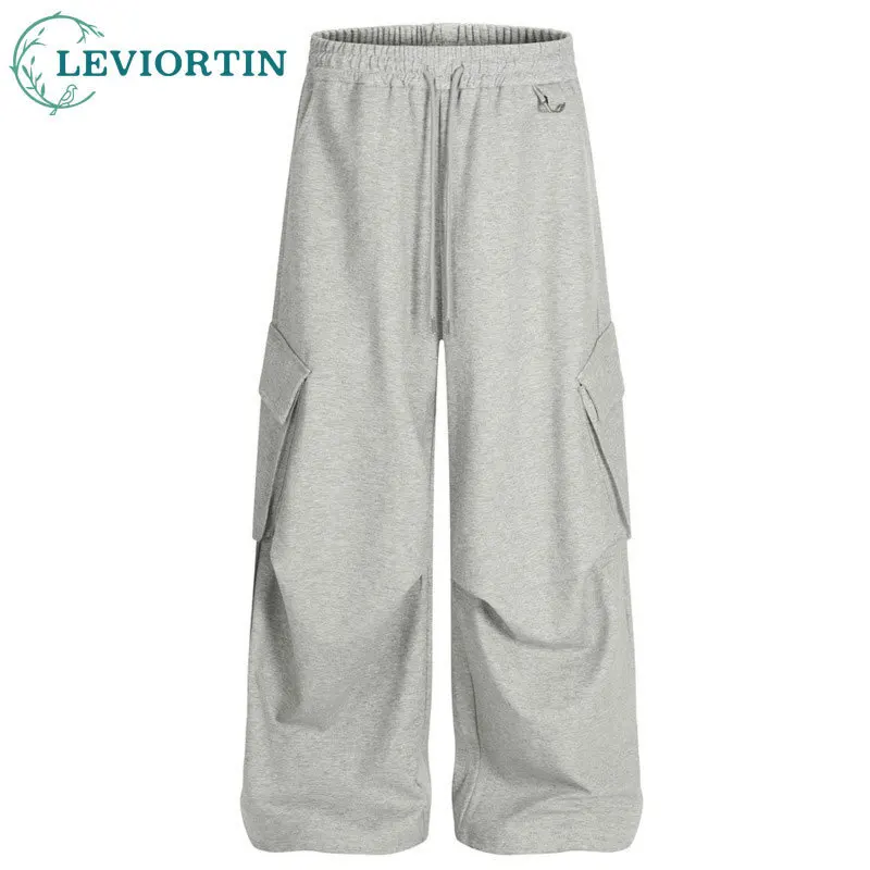 

Мужская модная модная карманная спецодежда свободного дизайна, плиссированные провисающие колено, повседневные и универсальные широкие брюки.