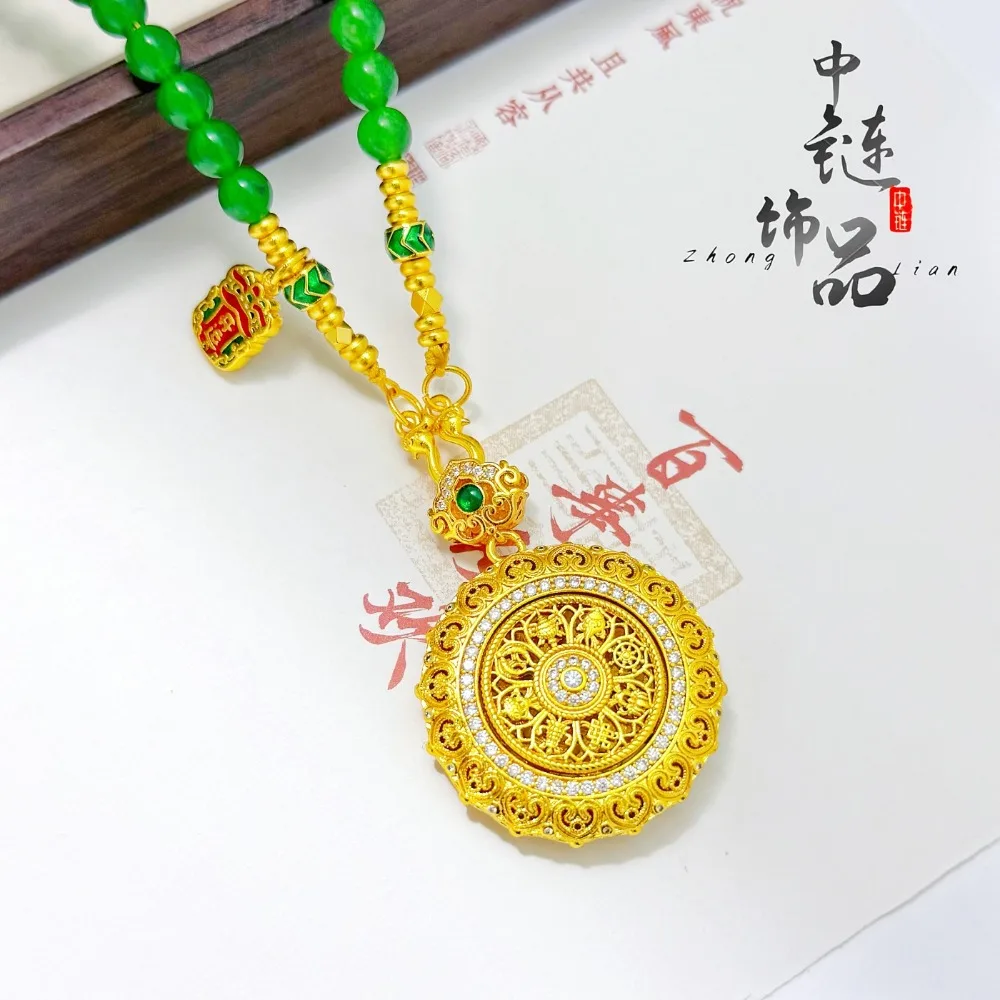 A diamond-encrusted rotating compass pendant 9999gold