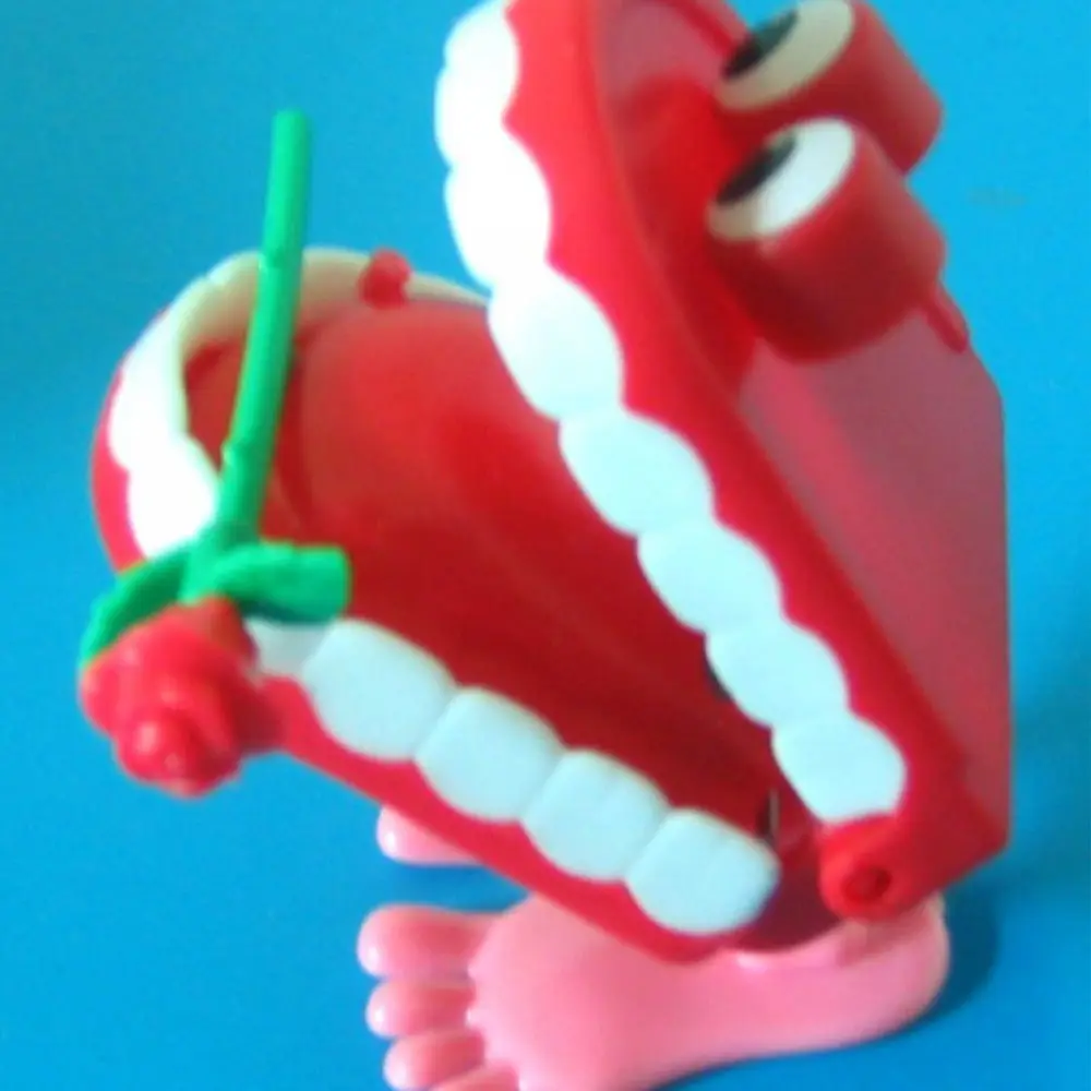 Simpatico plastica per protesi per bambini, denti che camminano a forma di carica, denti a orologeria, rosa a orologeria