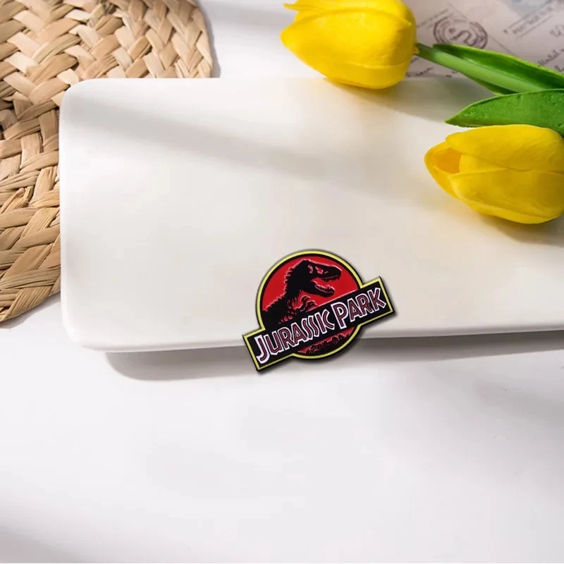 Jurassic Park Logo Pin Badge Steven Spielberg\'s Cinematic Masterpiece Brought Dinosaur Back From Extinction Onto The Big Screen!