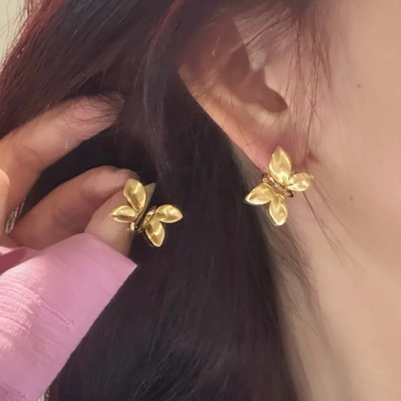 Metal brushed three-dimensional butterfly stud earrings women's niche design sense high-end earrings 2026 new temperament earrin