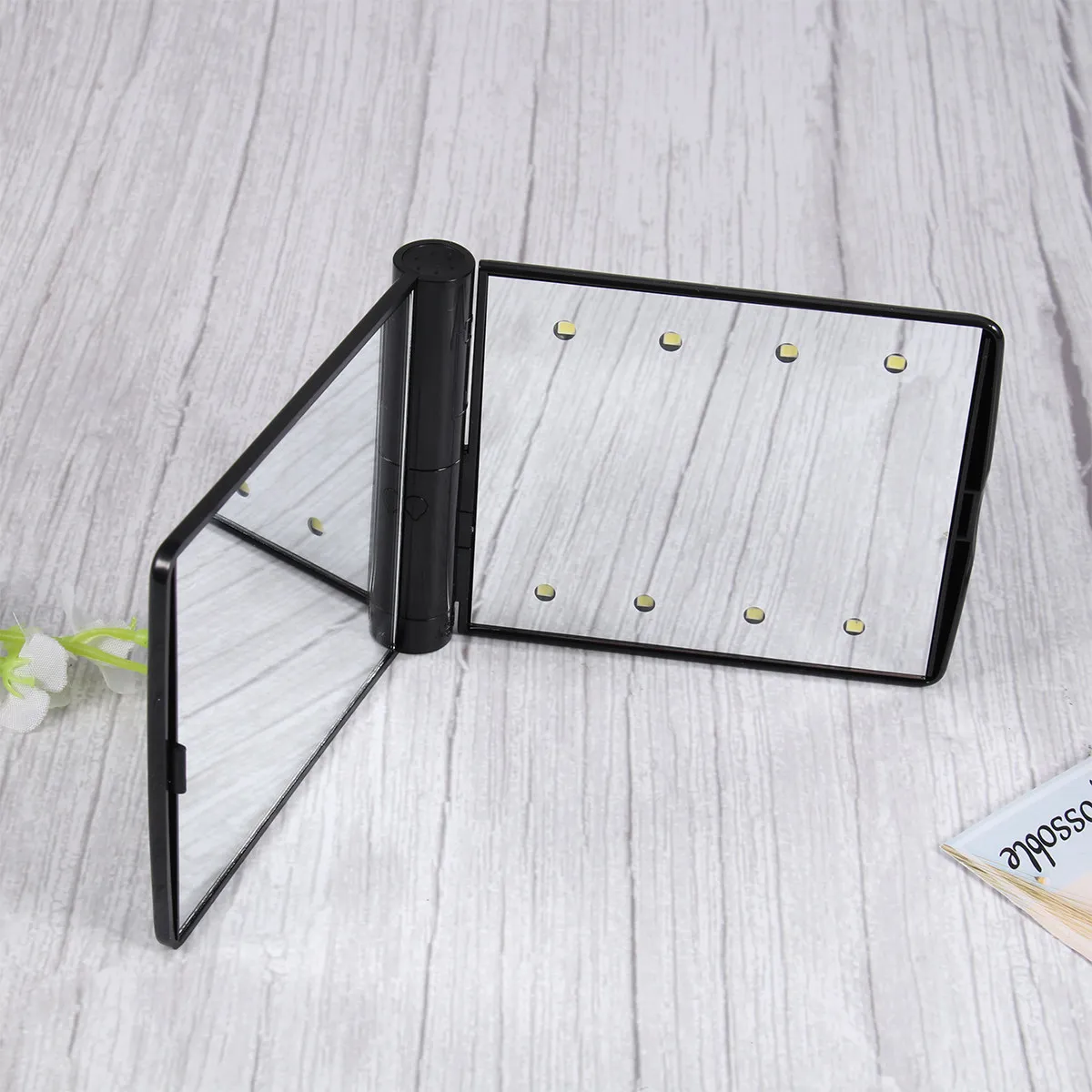 

Compact LED Lighted Makeup Mirror 8 Built-in Leds 330 Degree Swivel Foldable Design Portable for Travel Daily Routine