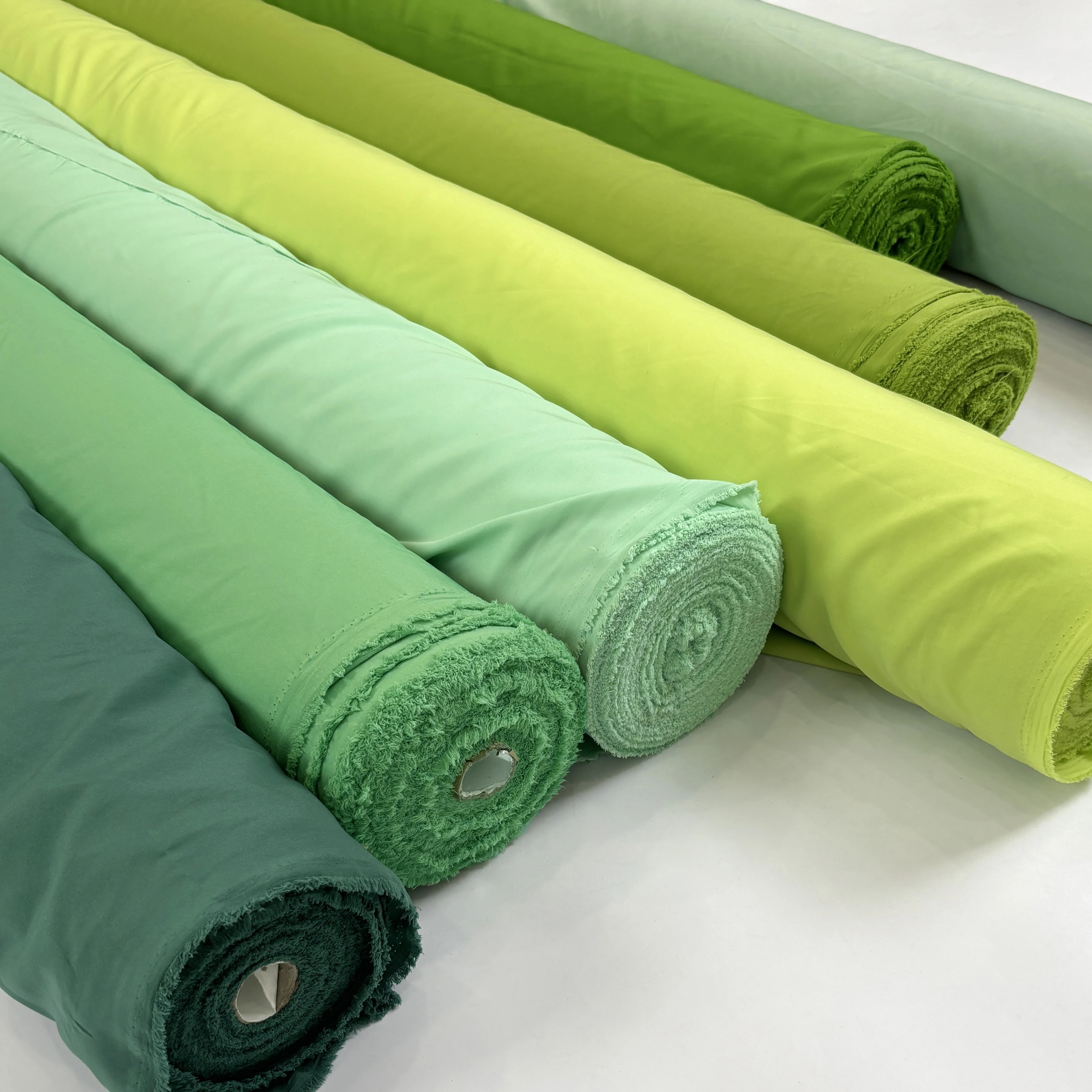 نسيج بطانة مرنة بأربعة جوانب ناعم بالمتر للملابس وسترة وتنورة وستارة مصنوعة يدويًا من القماش العادي باللون الأخضر والأزرق