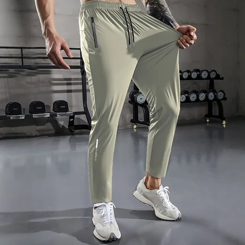 Imagen 1 del producto [Relación casera] Pantalones deportivos informales para hombre, tela tejida de alta elasticidad, color sólido, ajuste regular con cordón en la cintura y cremallera