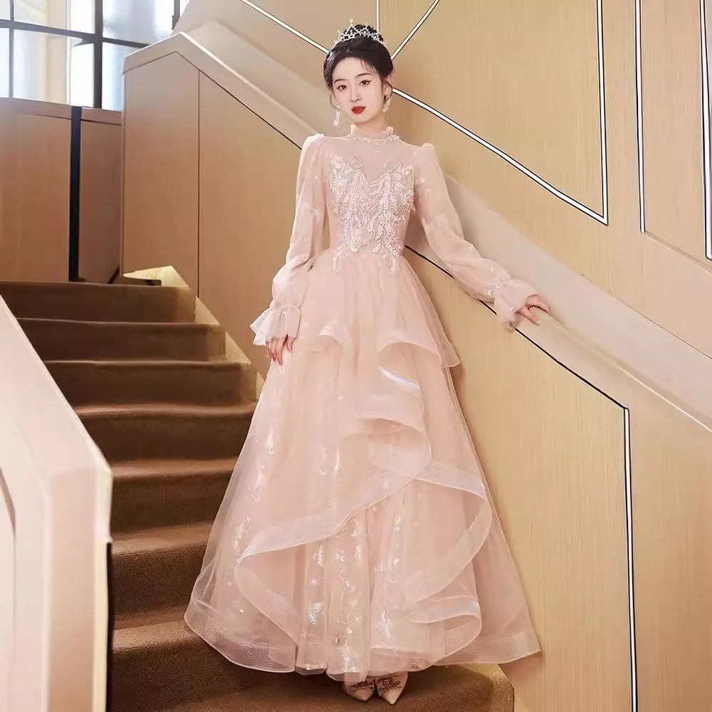 

Pink art test evening dress women's 2024 new long-sleeved light luxury niche temperament long banquet host fluffy skirt