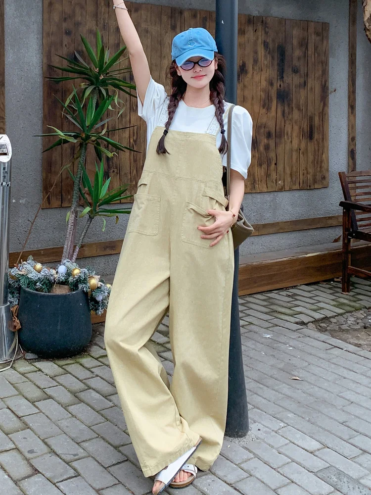 จั๊มสูททำงานสีกากี แต่งขอบลูกไม้ สไตล์ลำลองสำหรับผู้หญิง ฤดูร้อน หวานซ่อนเปรี้ยว ดูอ่อนเยาว์ กางเกงขายาวเอวสูงทรงขากว้าง