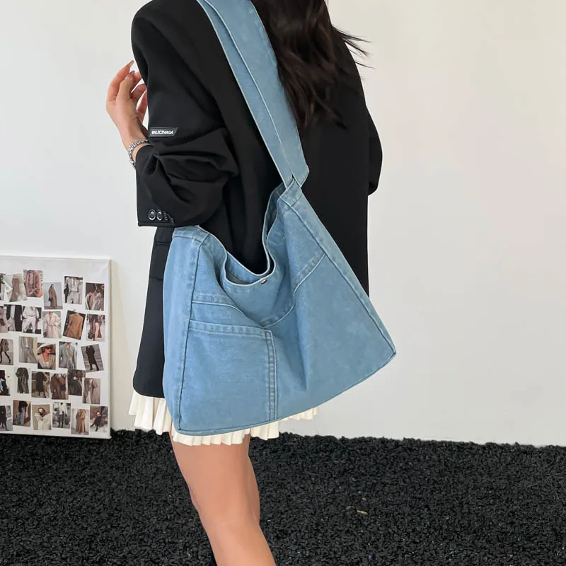 

Новинка 2026: Модные джинсовые сумки через плечо — однотонные, с застежкой, большой вместимости, повседневные, простые, прочные, универсальные.