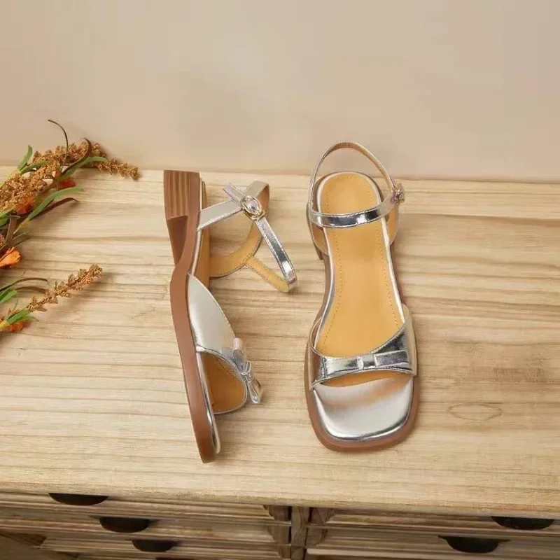 Bow shaped buckle strap sandals for women with flat soles and thick heels. 2024 Summer New Versatile Fashion Gold Silver